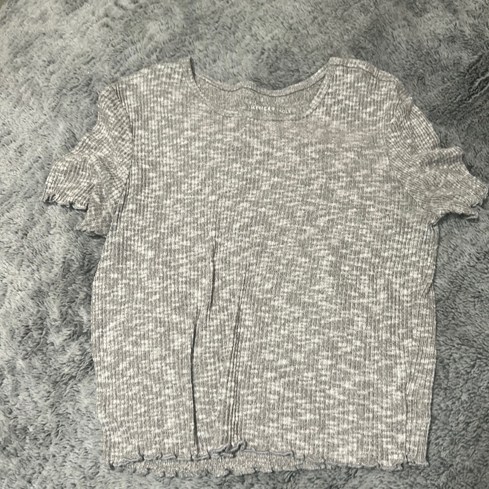 Grey top.